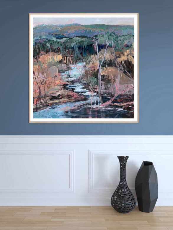 Framed abstract landscape painting on a blue wall with two vases on a wooden floor.